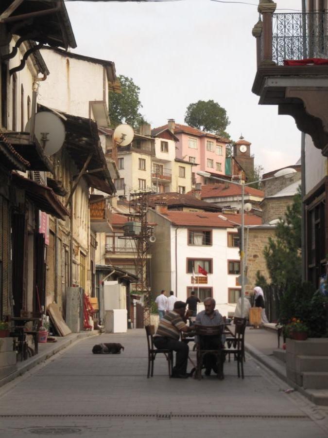 Old man sitting on the street in Mudurnu